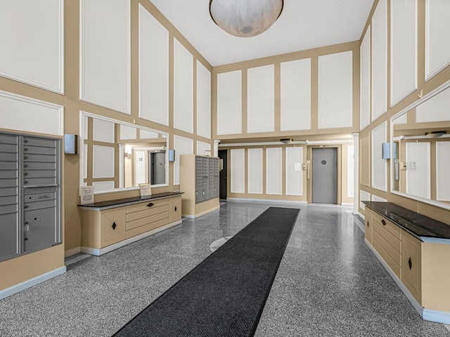 5235 Post Rd Unit 3H, Bronx, NY 10471 - building lobby with a towering ceiling and a decorative wall