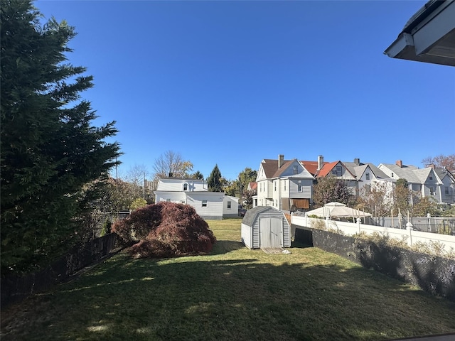 view of yard with a storage shed