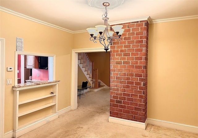 dining room with a chandelier, carpet floors, and ornamental molding