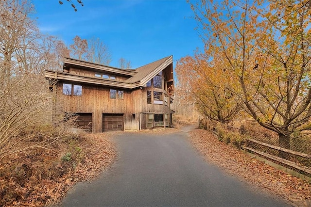 view of side of home with a garage