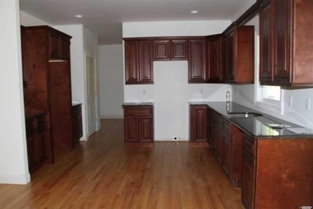 kitchen featuring sink and hardwood / wood-style flooring