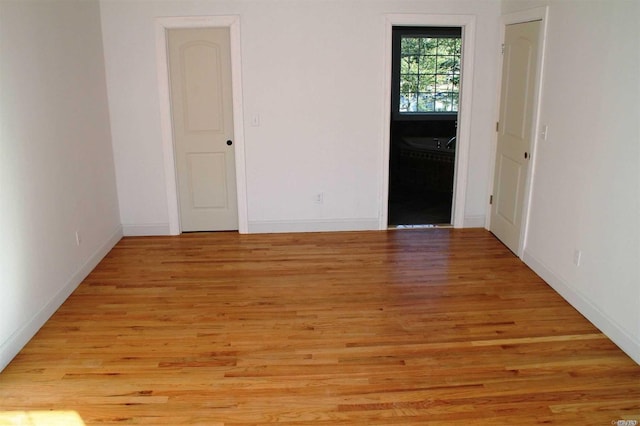 unfurnished room featuring light hardwood / wood-style flooring