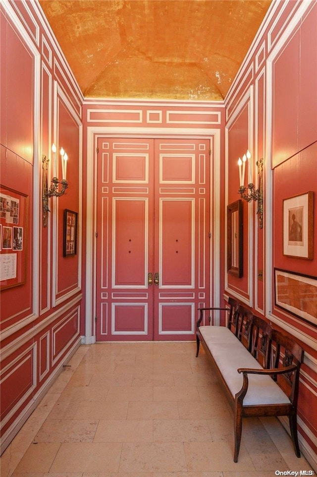 corridor featuring lofted ceiling