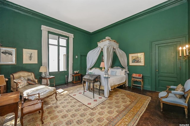 bedroom with dark parquet flooring and ornamental molding