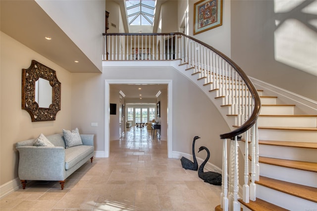 entryway featuring a towering ceiling