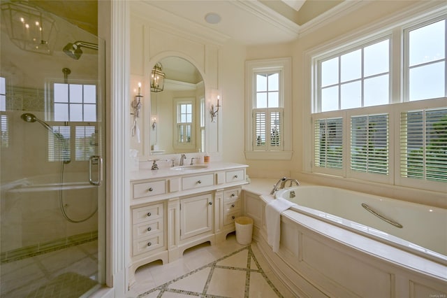 bathroom with crown molding, vanity, and independent shower and bath