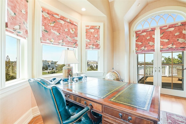 office area with hardwood / wood-style floors and french doors