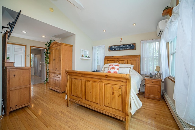 bedroom with baseboard heating, a wall unit AC, lofted ceiling, and light wood-type flooring