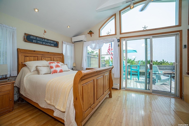 bedroom featuring access to outside, a wall mounted AC, a baseboard heating unit, high vaulted ceiling, and light hardwood / wood-style floors