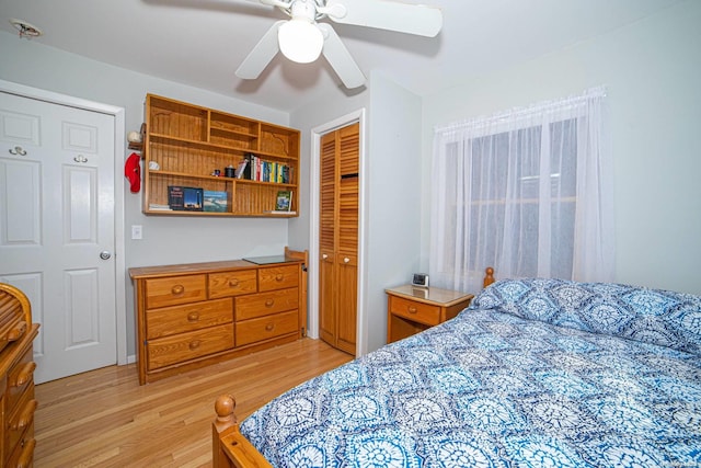 bedroom with ceiling fan, a closet, and light wood-type flooring