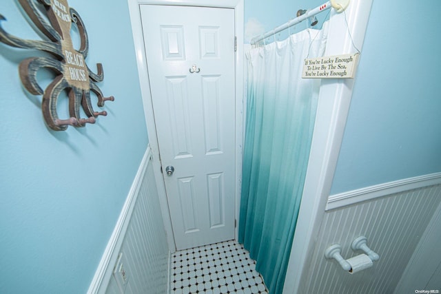 bathroom with a shower with shower curtain