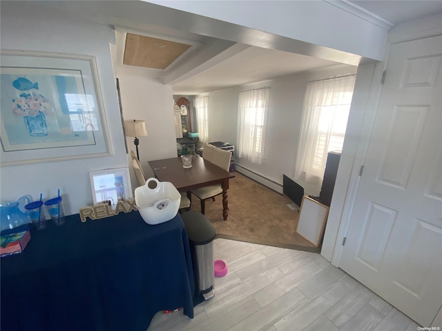 interior space featuring light hardwood / wood-style floors and a baseboard heating unit