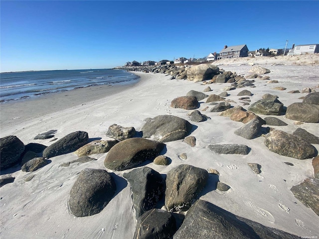 view of water feature with a beach view