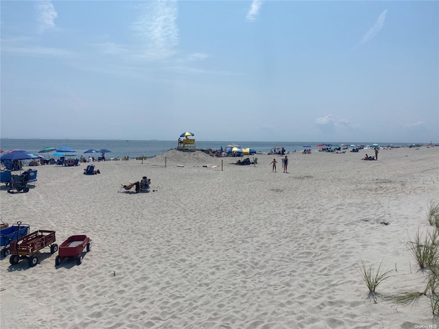 property view of water featuring a beach view