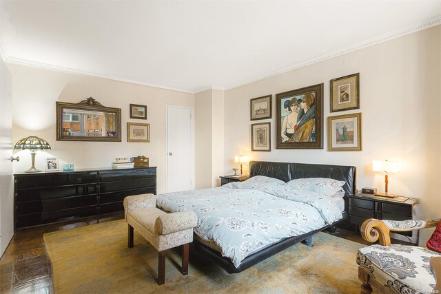 bedroom with parquet floors and ornamental molding