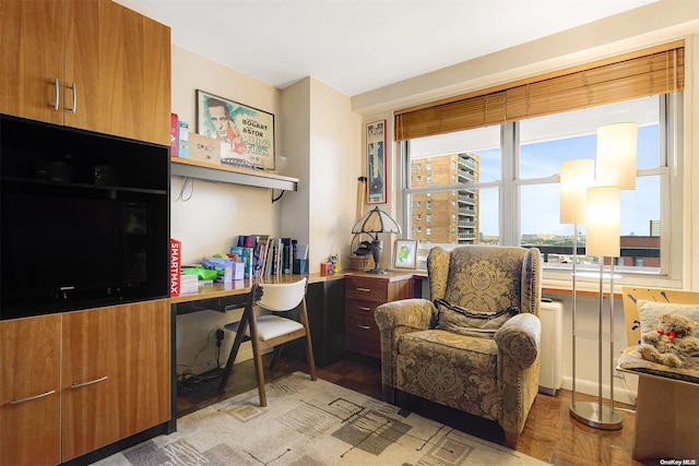 sitting room with light parquet flooring