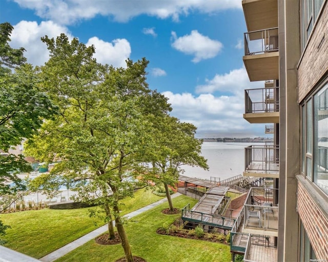 surrounding community featuring a water view