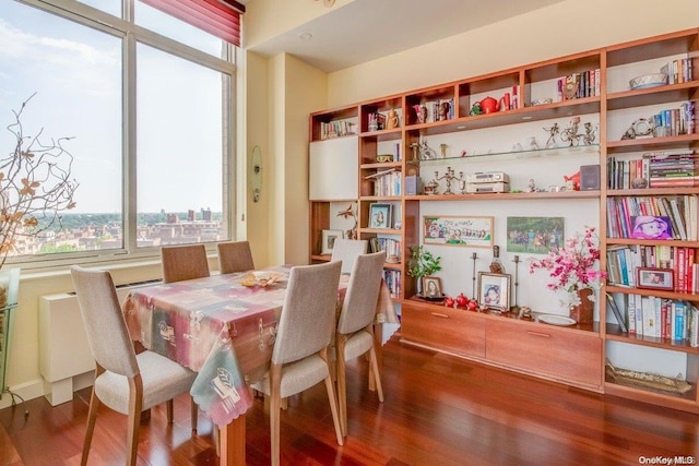 dining area with hardwood / wood-style flooring