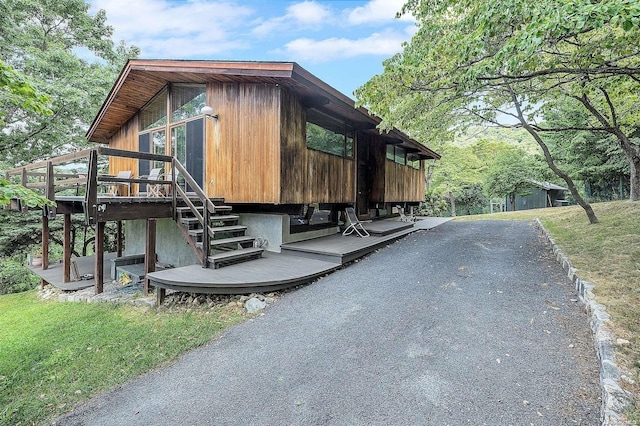 view of side of home with a deck