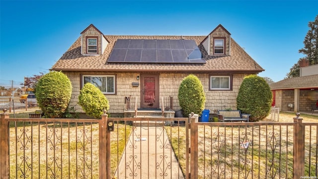 view of front facade with solar panels