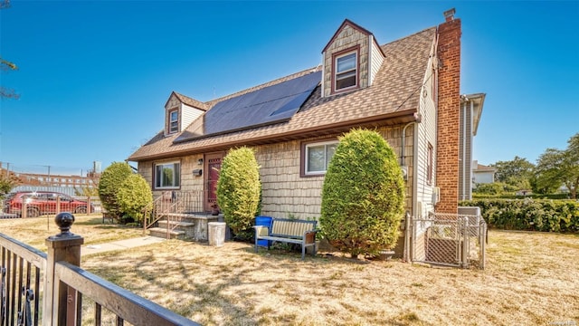 view of front of house featuring solar panels