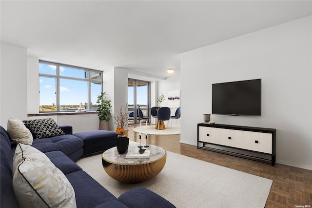 living room featuring parquet flooring