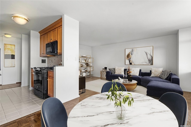 dining area with parquet floors