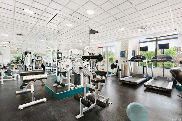 exercise room featuring a paneled ceiling