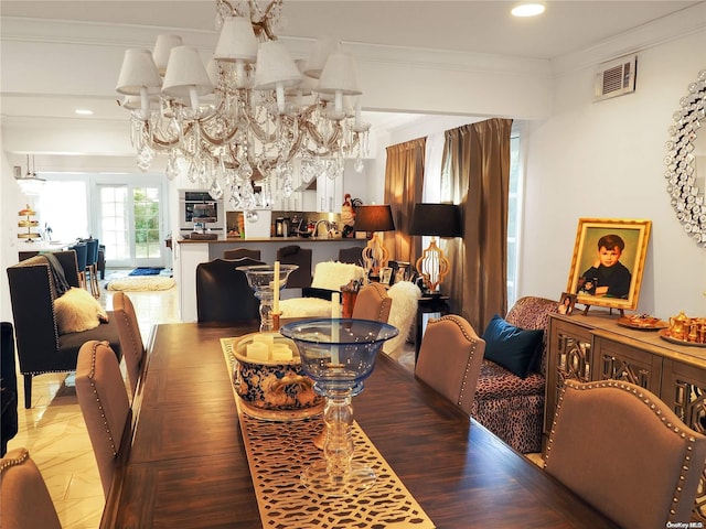 dining space featuring ornamental molding and a chandelier