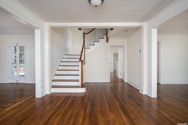 staircase with wood-type flooring and ornamental molding