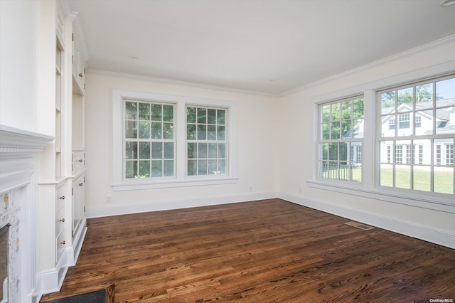 interior space with ornamental molding and dark wood-type flooring