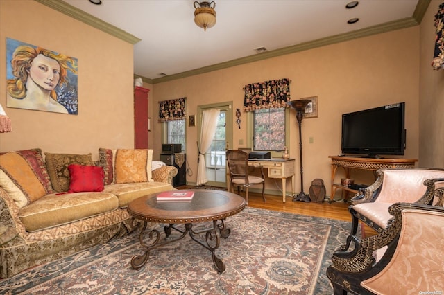 living room with hardwood / wood-style flooring and ornamental molding