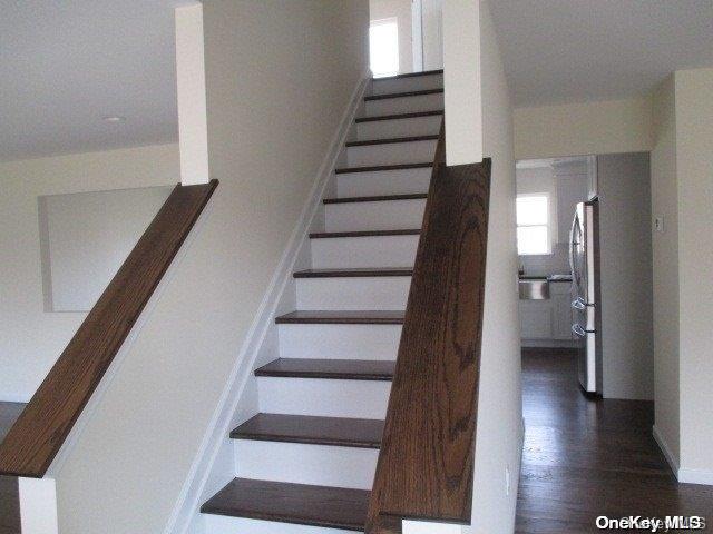 stairs with wood-type flooring