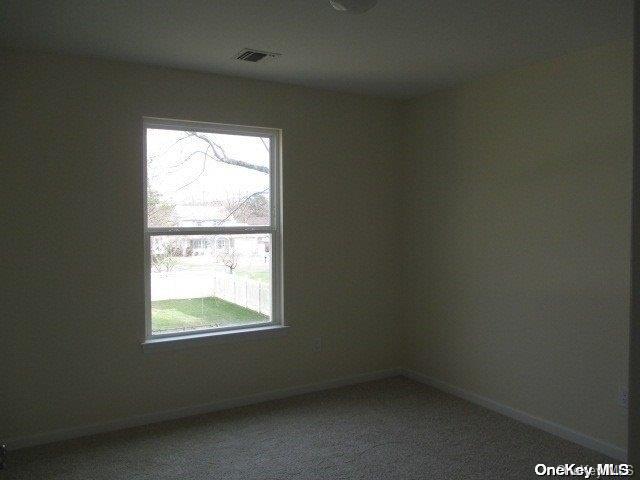 unfurnished room with carpet flooring