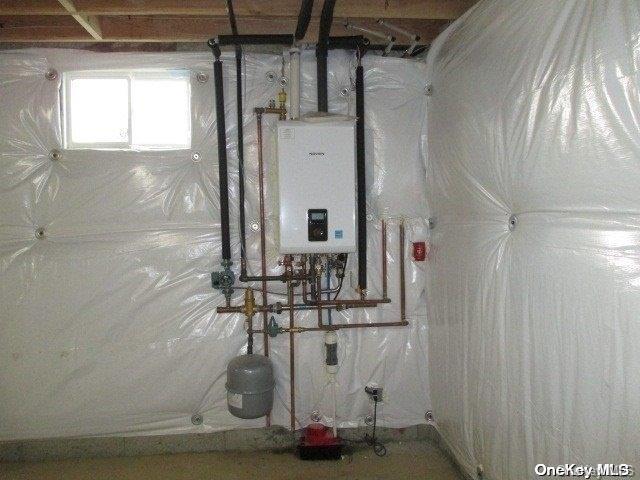 utility room with water heater