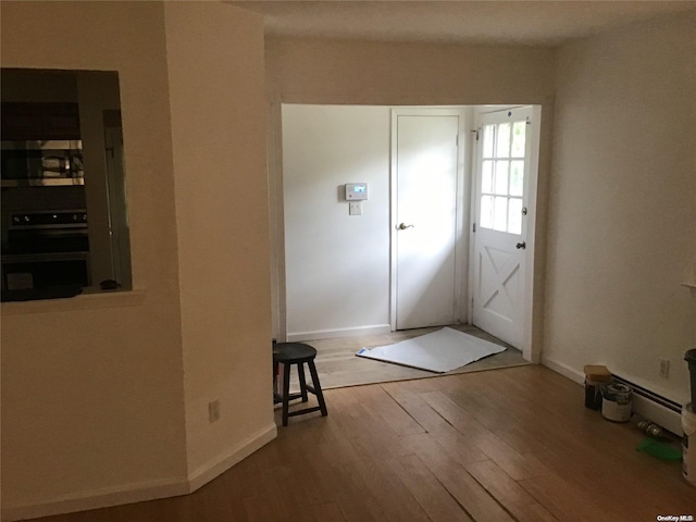 doorway featuring wood-type flooring