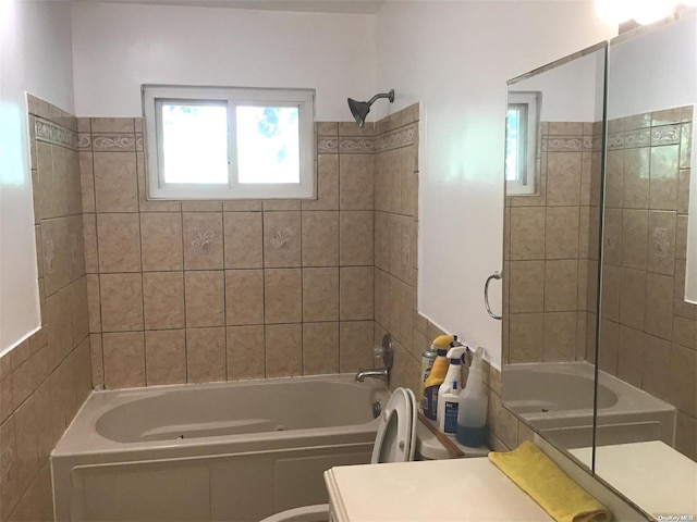 bathroom featuring vanity and tiled shower / bath combo