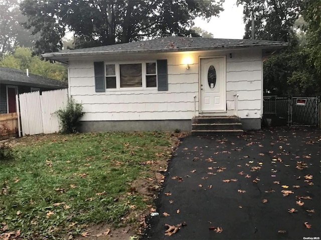 bungalow with a front lawn