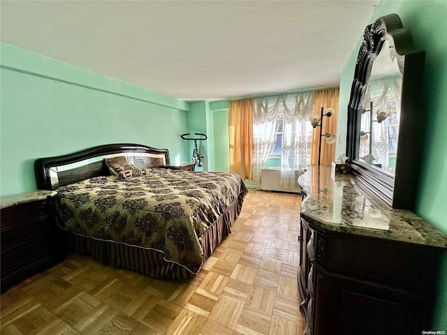 bedroom featuring light parquet flooring