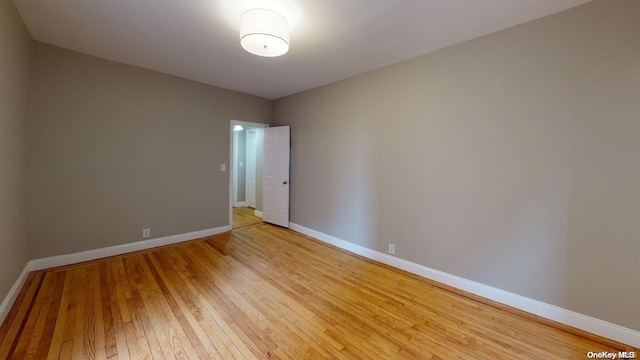 spare room featuring light hardwood / wood-style flooring