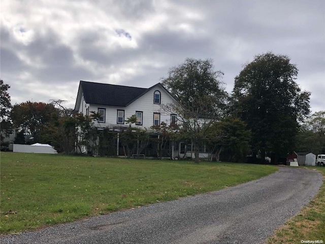 view of property exterior featuring a yard