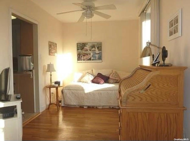 bedroom featuring ceiling fan and hardwood / wood-style flooring