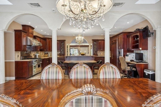 dining space with an inviting chandelier