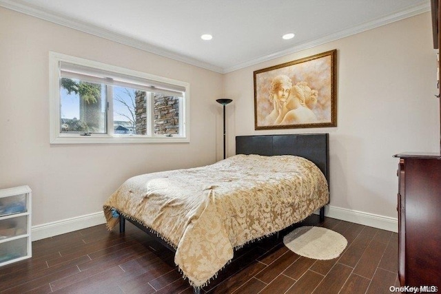 bedroom featuring dark hardwood / wood-style flooring and crown molding