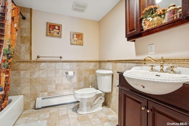 full bathroom with vanity, a baseboard radiator, toilet, and tile walls