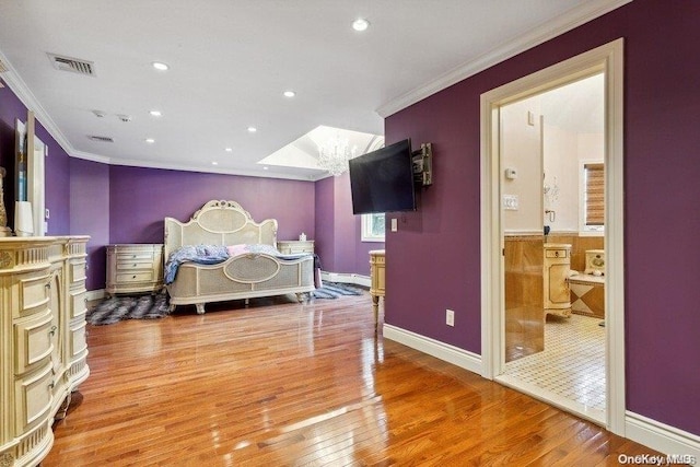 bedroom with light wood-type flooring and ornamental molding