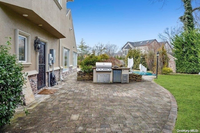 view of patio / terrace with an outdoor kitchen and area for grilling