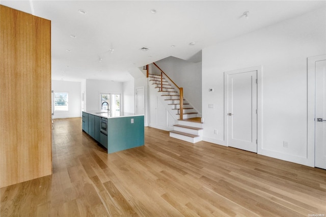 interior space featuring light hardwood / wood-style flooring and sink