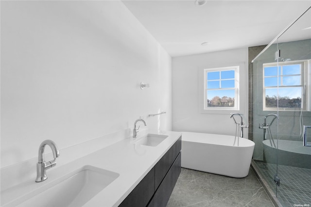 bathroom featuring tile patterned floors, plus walk in shower, and vanity