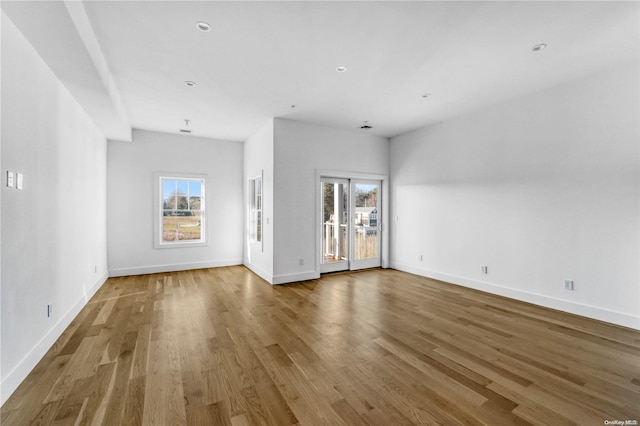 unfurnished living room featuring hardwood / wood-style floors